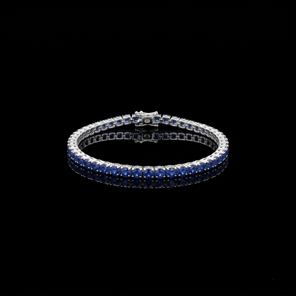 Brazalete tipo tennis con zafiros azules en oro 18k
